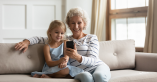 Grandmother sitting with grand daughter